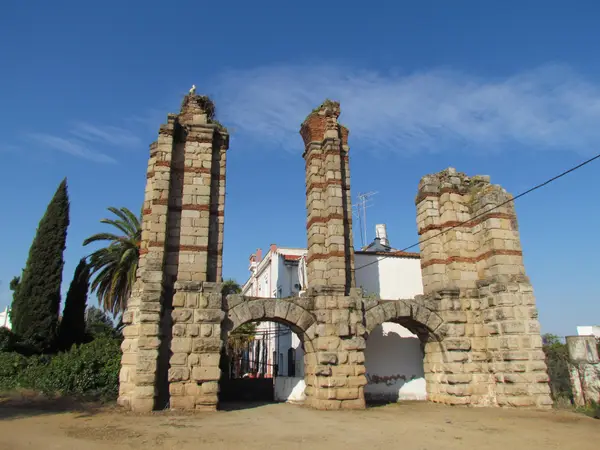 The three piers and the two arches joining them: all that stands of the Roman arcade